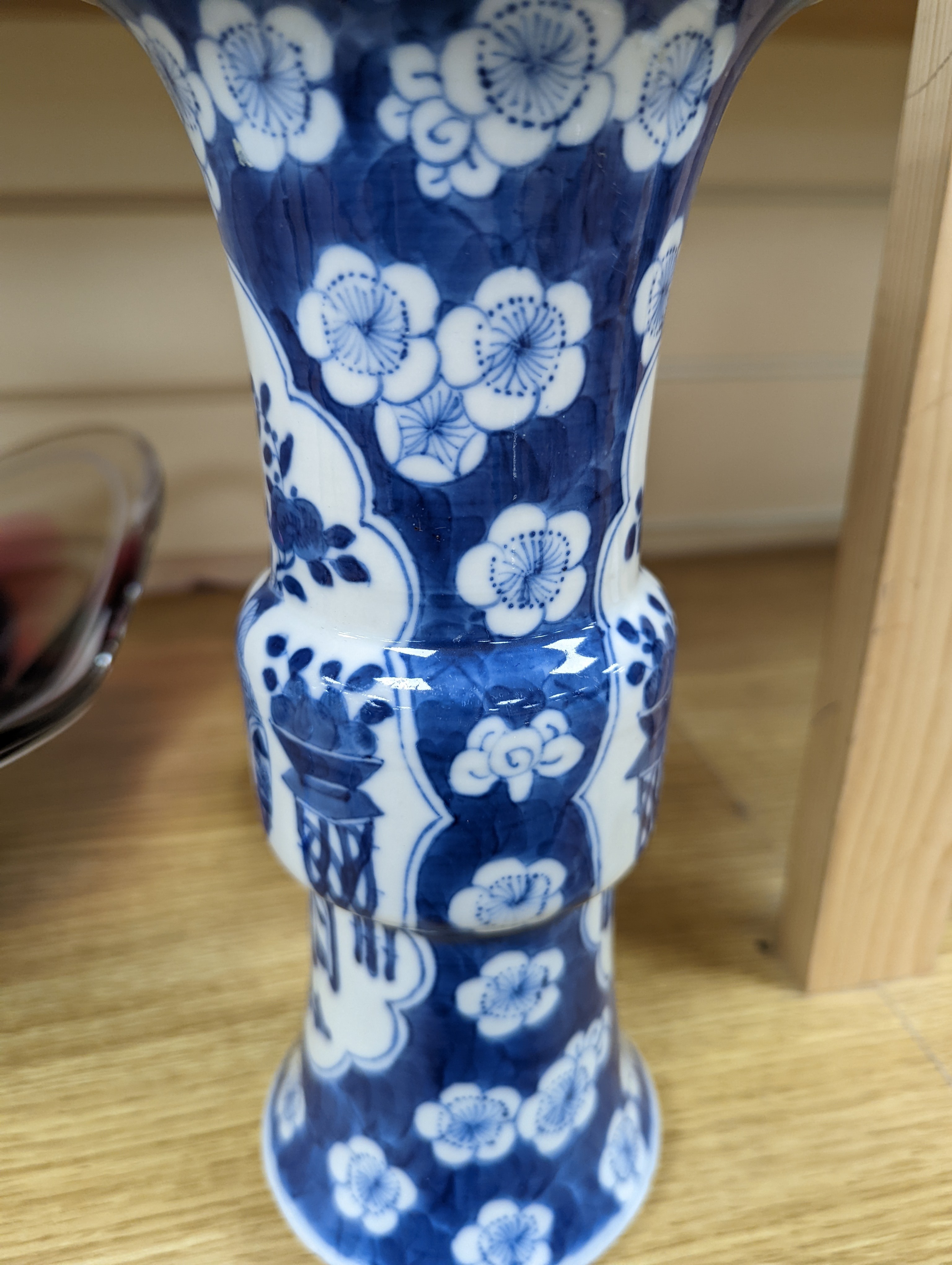 A 19th century Chinese blue and white prunus gu vase, 25 cms high.